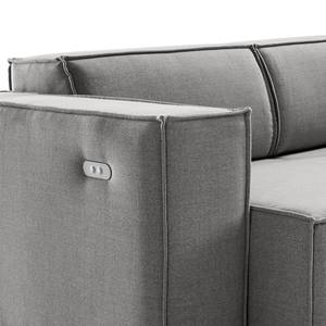 Canapé d’angle KINX ottomane Tissu - Tissu Milan : Gris clair - Méridienne longue à droite (vue de face) - Avec réglage de la profondeur d'assise