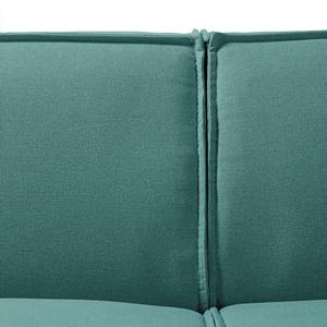 Canapé d’angle KINX ottomane Tissu - Tissu Osta: Pétrole - Méridienne longue à gauche (vue de face) - Avec réglage de la profondeur d'assise