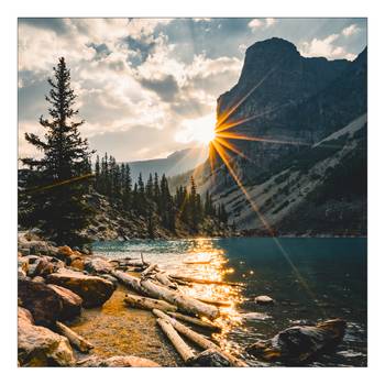 Glasbild Sonne am Bergsee