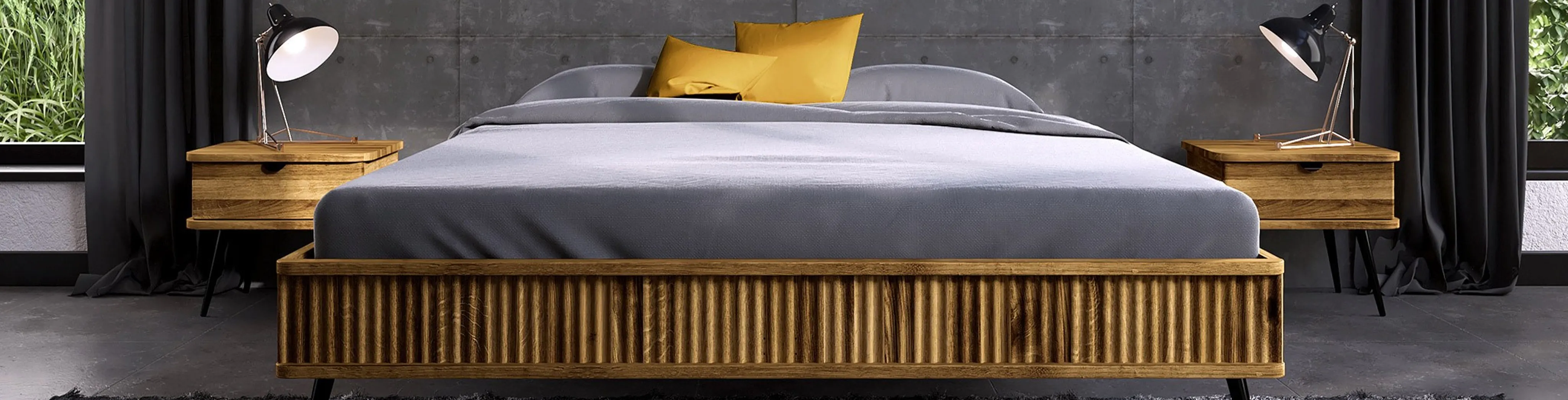 Elegantes Futonbett mit Struktur und passenden Nachttischen vor einer Sichtbetonwand