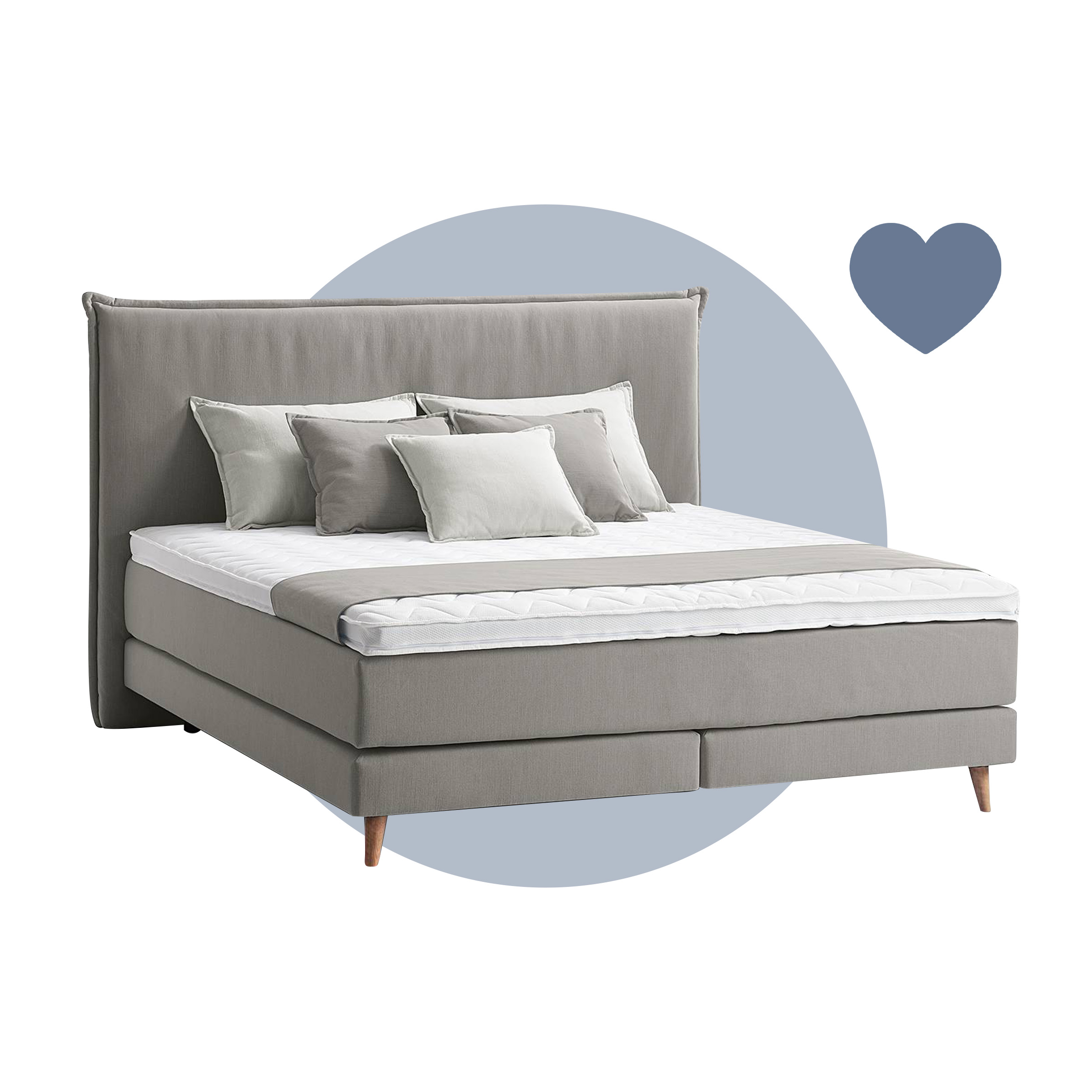 Graues Boxspringbett Avellino mit passenden grauen Kissen und Tagesdecke