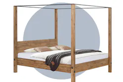 Himmelbett aus Massivholz vor einem blau illustierten Kreis