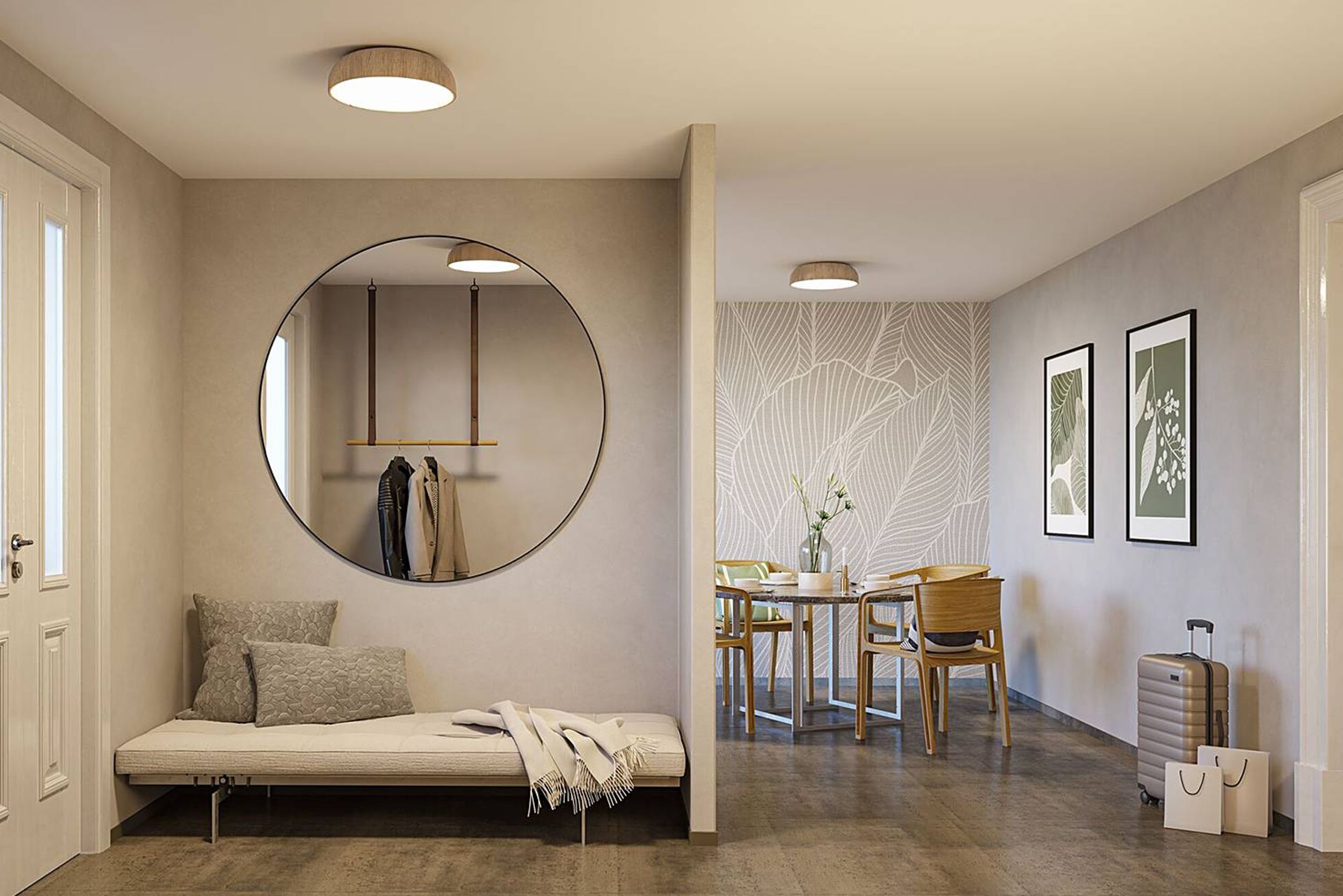 Gut beleuchter, heller Eingangsbereich in hellen Farben, mit einem großen runden Spiegel und strategisch platzierten home24-Deckenleuchten