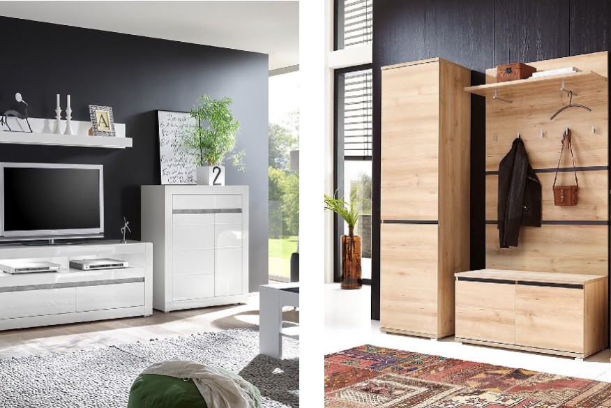 Soggiorno e ingresso, arredati con mobili moderni e un tappeto, con pareti nere e una grande vetrata di finestre