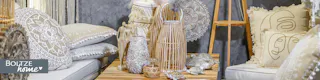 Laternen aus Rattan und beige Kissen im Boho-Stil von Boltze home