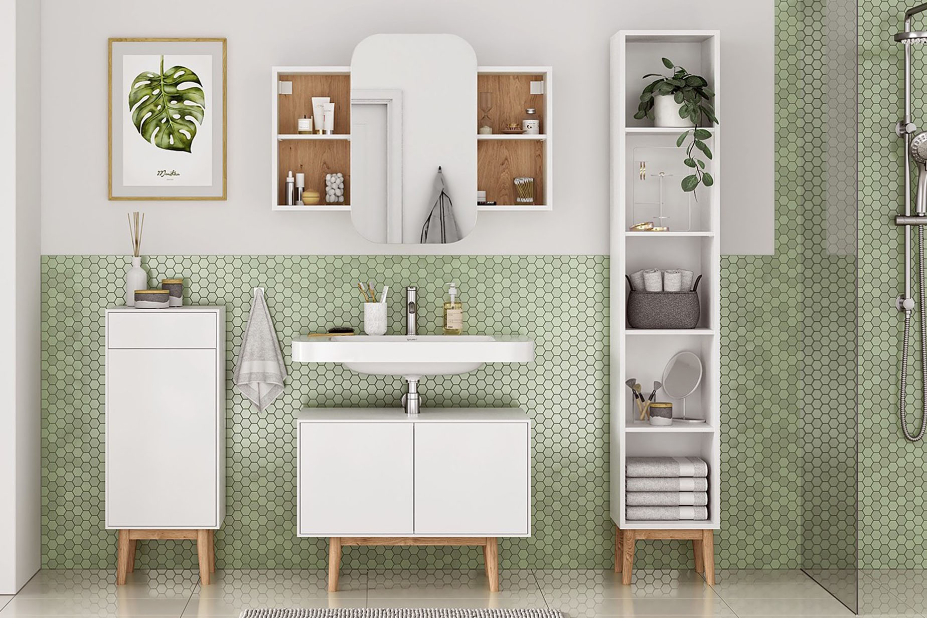 Meubles de salle de bain blancs de style scandinave devant un papier peint vert.
